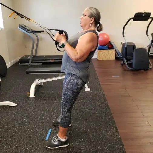 Woman doing cable strength exercise at Key Fitness Personal Training gym