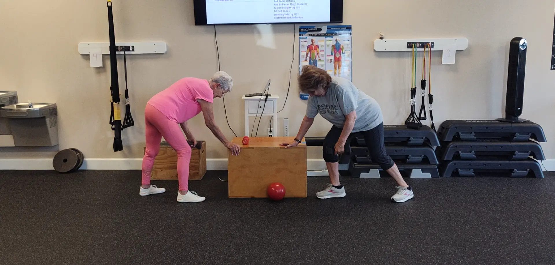 Clients performing strength training exercises at Key Fitness Personal Training